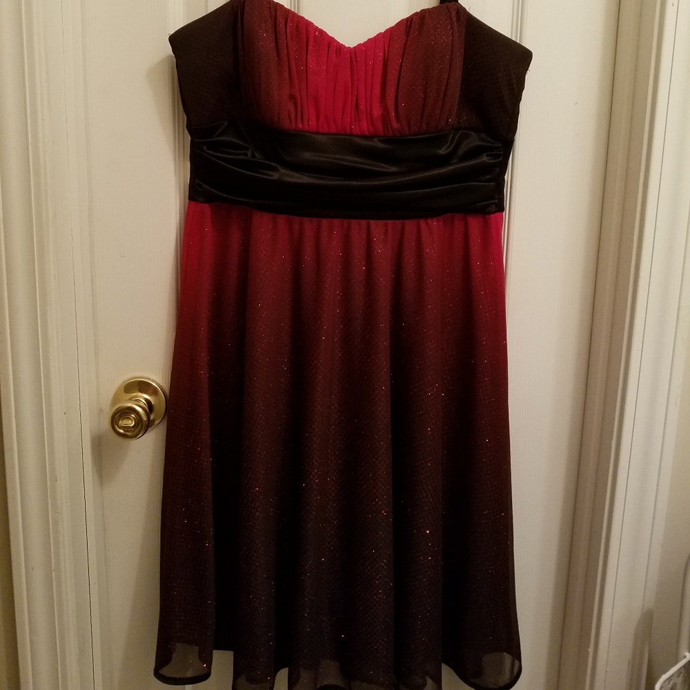 A knee length red and black formal dress